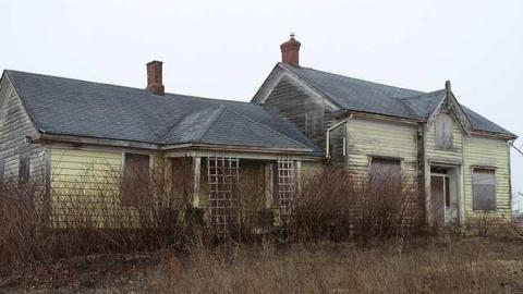 Photo from yellow farm house and barn 