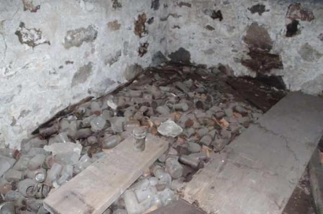 Fenel Rd home interior views - Dozens of old bottles on crawl space floor.jpg