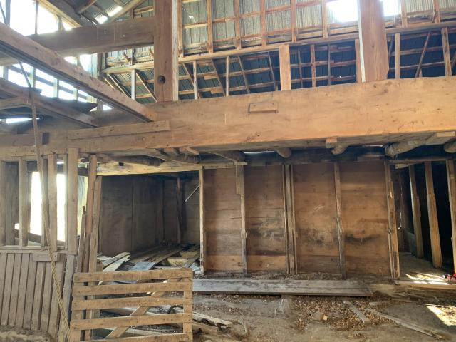 Long abandoned horse barn photo 5