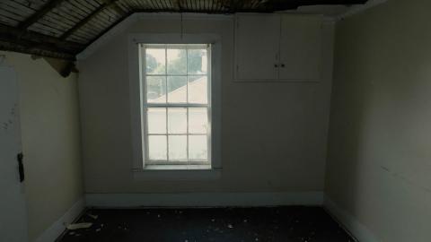 1st bedroom, notice the remnants of the pressed tin ceiling.