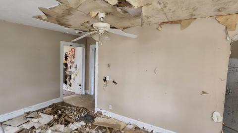 Note the totally off centre ceiling fan