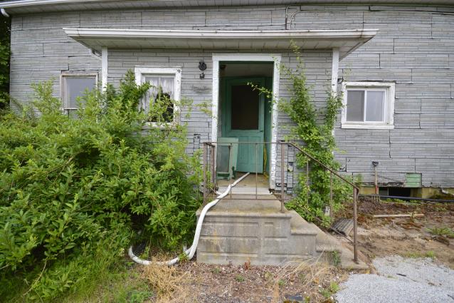 Abandoned House with an Active House photo 5