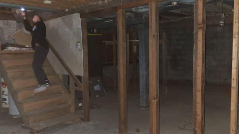 Stairs from the garage to the main floor of House 1