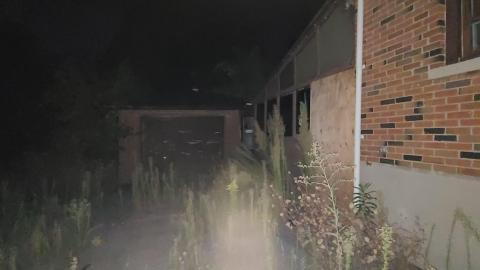 Garage on the rear left exterior of House 2