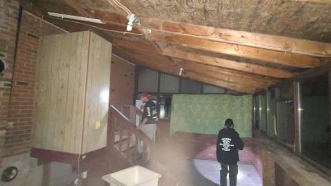 Open entryway on the rear exterior of House 2