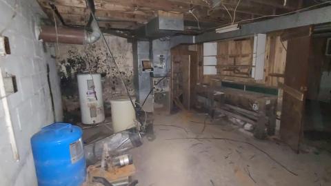 Furnace room in the basement of House 2