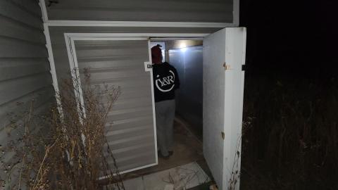 Small storage shed built into the side rear of House 4