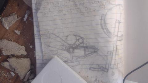 A notebook with writing and drawings