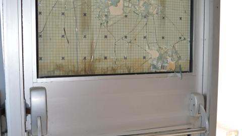 Boarded, broken door