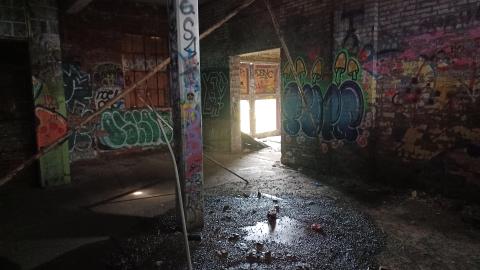 graffiti covered walls with light streaming in