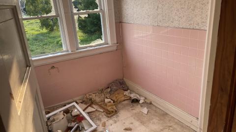 Small room with broken window