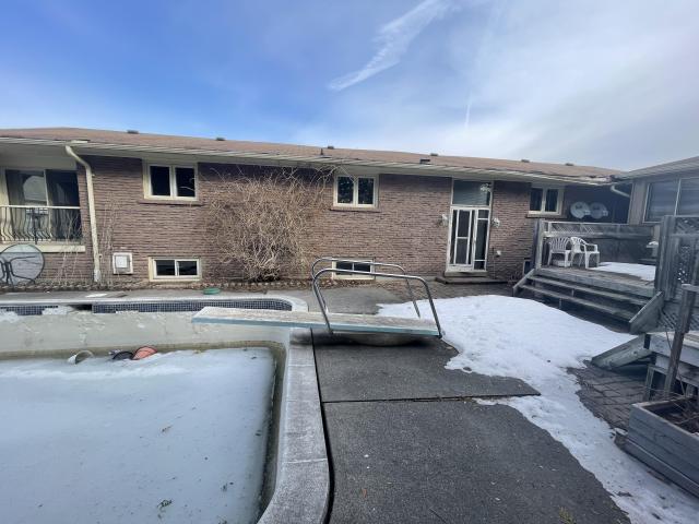 70s bungalow sits in a neighborhood of new mansions photo 2
