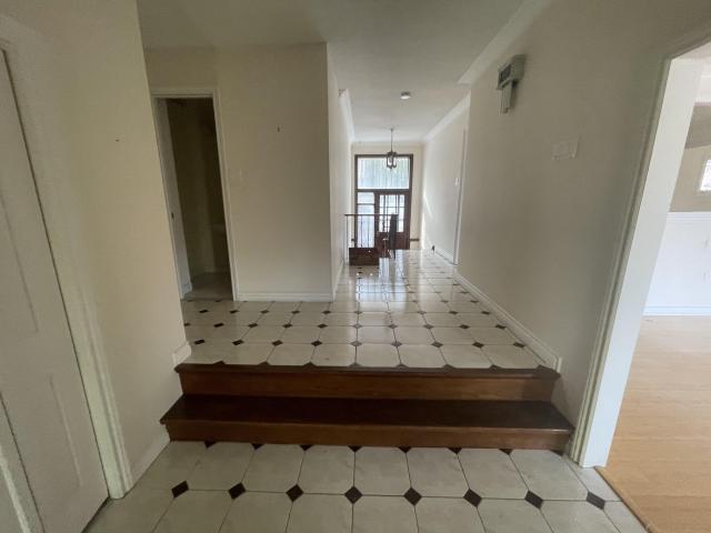 70s bungalow sits in a neighborhood of new mansions photo 5