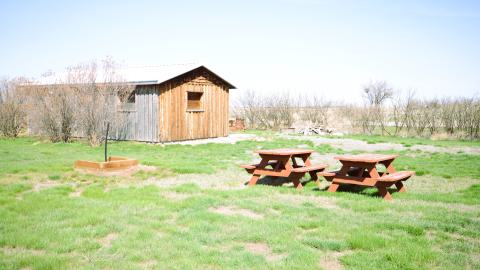 "The Tumbleweed Inn" with picnic benches nearby