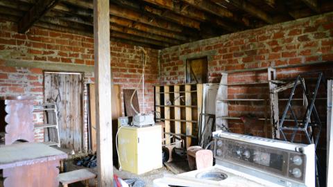 Another angle of the junk-filled room