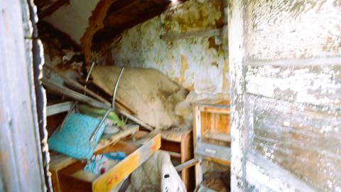 The inside of what used to be a house, which is now used as storage