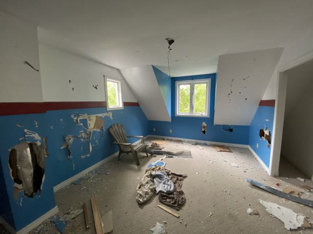 a bedroom upstairs, the chair is to prop you up for the roof.