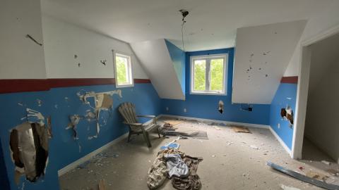 a bedroom upstairs, the chair is to prop you up for the roof.