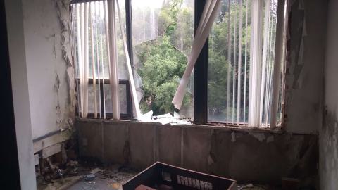 Broken AC unit by a window