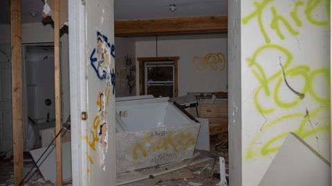 A shot of the kitchen and bathroom (just to the right of the staircases)