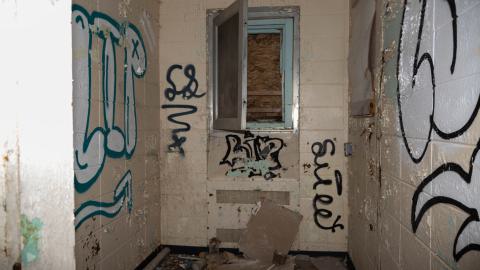 Another room with a boarded window