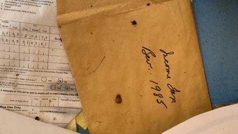 An envelope dated 1985