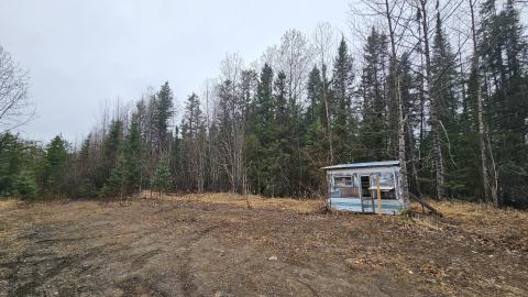 A view from a distance of the trailer in the turnaround off the road