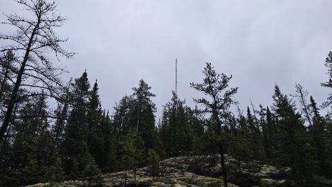 A radio tower on the top of an outcrop