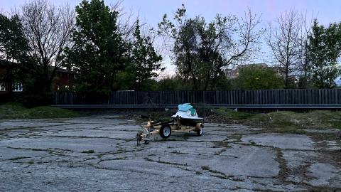 a small jetski in the nearby parking lot