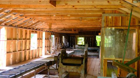 Main floor, roller system to push wood through sawmill