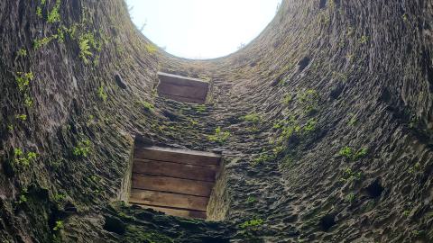 Inside the watch tower, the wood floors and staircase are no longer present