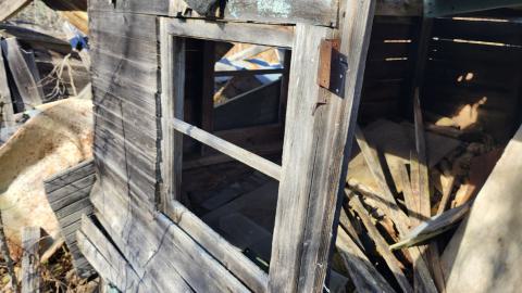 First structure to left of cemetery