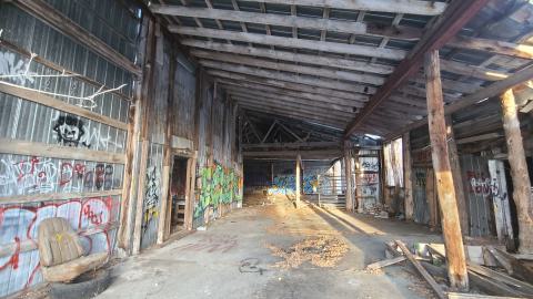 The shop is very large and open concept. Remnants of hang out areas with couches can be seen.