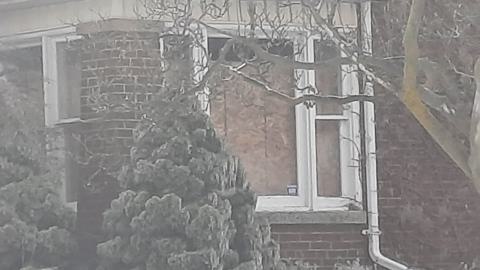 The window is boarded up from the inside and the window is not in bad condition.