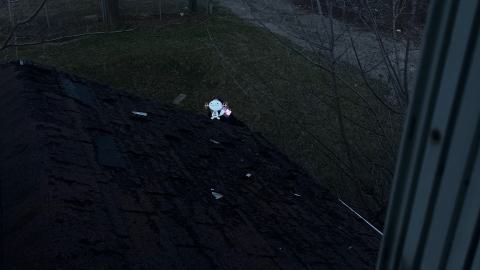 a view of a small street from an abandoned house