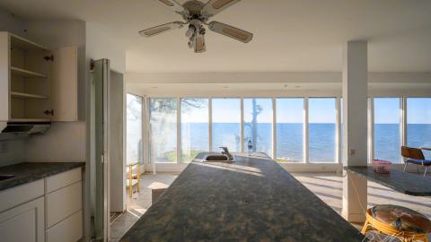 "You need your art spoon-fed to you" - Abandoned Waterfront Home With Artwork Left Behind-6.jpg