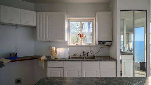 "You need your art spoon-fed to you" - Abandoned Waterfront Home With Artwork Left Behind-7.jpg