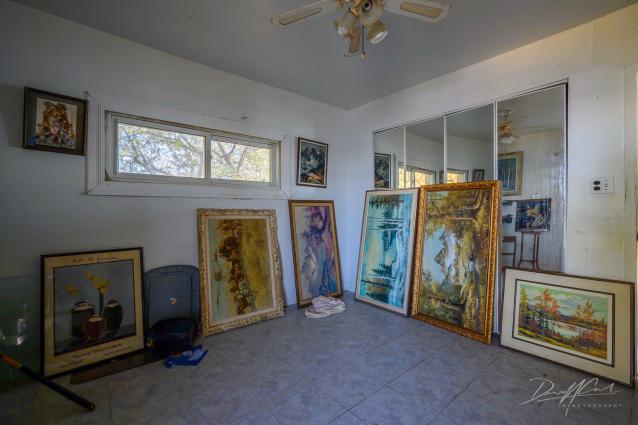 "You need your art spoon-fed to you" - Abandoned Waterfront Home With Artwork Left Behind-12.jpg