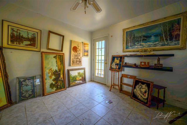"You need your art spoon-fed to you" - Abandoned Waterfront Home With Artwork Left Behind-13.jpg