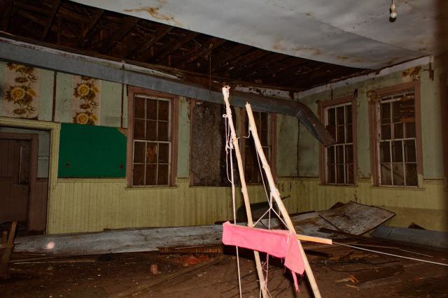 Ceiling collapsed onto the classroom floor.