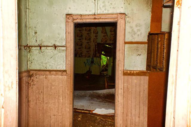 Peering into the classroom and bathroom from the hallway.