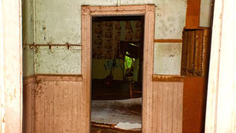 Peering into the classroom and bathroom from the hallway.