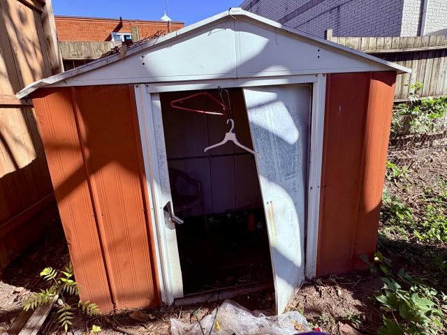 The shed in the far back corner