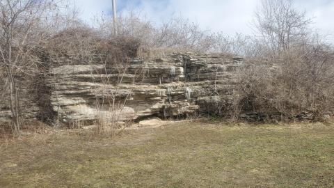 shale rock wall with icicles